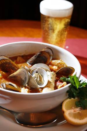 French bouillabaisse, packed with mussels, clams, lobster and other seafood.
