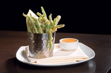 Fun, different bar snacks are on the menu at Heraea, including these crispy green beans with chili aioli.