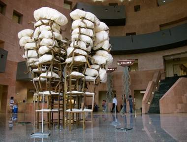 A 16-foot tower made of more than 50 stacked chairs.