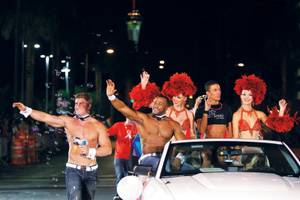 Many local organizations join in on the Pride parade fun, including the casts of Chippendales and <em>Divas</em>.