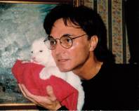 Roy Horn with a white tiger cub. October 3 marks the tenth anniversary of the incident where Roy was dragged offstage by white tiger Montecore during a performance of <em>Siegfried &amp; Roy</em> at the Mirage.