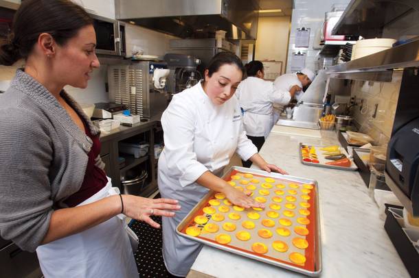 Chef Monica Delgadillo shows Sarah Feldberg the finer points of cookie creation.