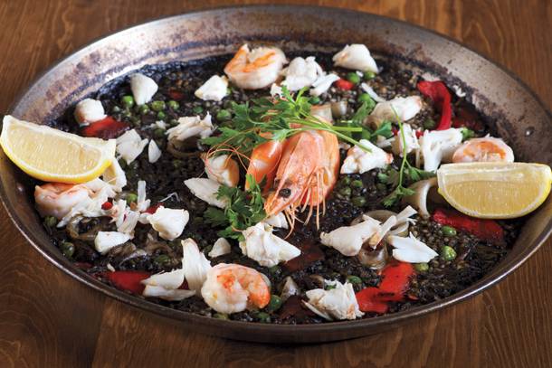 Toros' paella negra is black rice laced with shrimp, squid and crab meat.