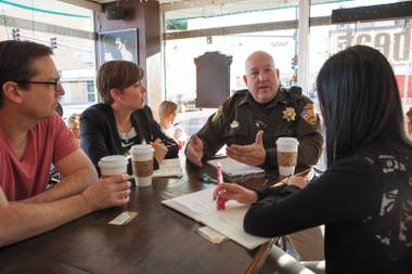 Meeting of minds: David Gould, left, Lindsay Hyde and Amy An, right, meet with Lt. Harry Fagel at the Beat.