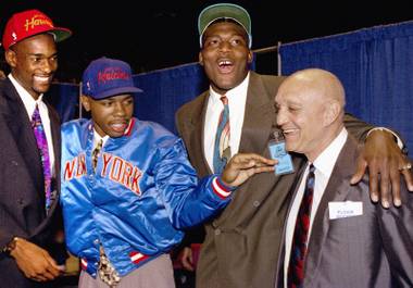 Rebel pride: Former UNLV players (from left) Stacey Augmon, Greg Anthony and Larry Johnson, with then-coach Jerry Tarkanian.
