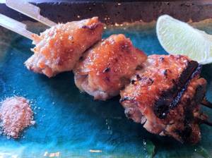 Yusho's remarkable grilled chicken wings are boneless, smoky and delicious, served with lime and bonito salt.
