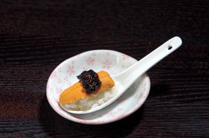 Cocokala's sea urchin and <em>nori</em> paste spoon rice, oceanic essence in a single shot.