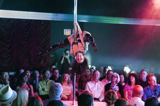 A dancer spins on a pole during the 12th Year Anniversary show of 