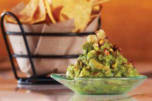 Start your Mercadito experience with the bacon, hominy and habanero-fueled <em>tocino</em> guacamole.