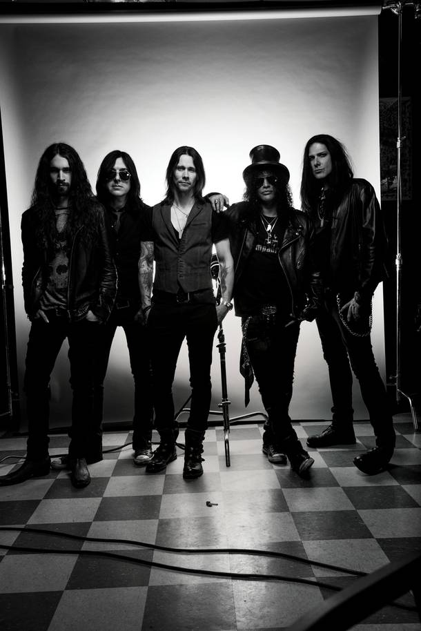 Frank Sidoris, left, stands with Slash featuring Myles Kennedy and the Conspirators. 