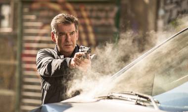 Brosnan isn't James Bond, but the comparisons are unavoidable.