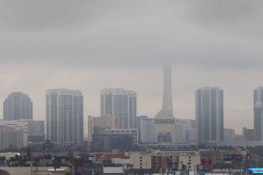 Foggy weather veils the top of the Stratosphere in this skyline shot of the city on December 4, 2014.
