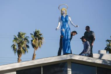 Ali Fathollahi places the Blue Angel sculpture