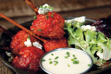 Farm bird lollipops are similar to Japanese tsukune … with hot sauce. 