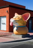Smigel conceptualized his sculpture as a photo op, its face all goofy pleasure while giving a tongue-bath to anyone who gets close.
