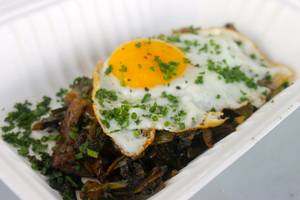 SLO-Boy's stewed dandelion greens with sunny side-up egg.