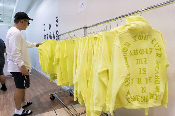 A customer browses the merchandise at the Kanye West Pablo pop-up shop at Fashion Show Mall, Friday, Aug. 2016.
