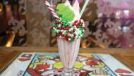 The Candy Cane Bam-Boozled Shake combines rich vanilla ice cream and peppermint schnapps with crushed candy canes, peppermint glaze and more.