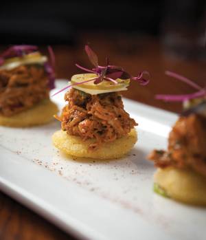 Pretty little pulled chicken "arepas" at Beauty & Essex.