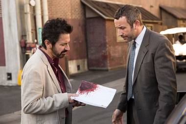 Romano (left) and O’Dowd examine a blood-soaked screenplay.