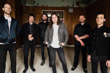 Hartley (far left), Granduciel (third from right) and their War on Drugs mates play Brooklyn Bowl on April 11.