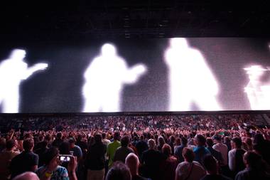 U2 performs behind a 100-foot-wide screen at T-Mobile Arena on May 11, 2018. 
