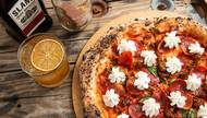 The pizza we are featuring with Slane Irish Whiskey is called The Stewart. This pie features a tomato sauce base with parmesan and fresh garlic slices, house-made spicy sausage, pepperoni and finished with fresh dollops of garlic whipped ricotta.