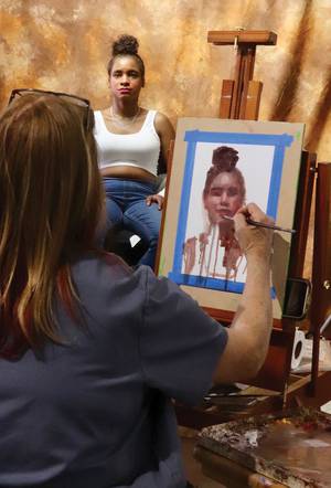 Resident artist Cheryl Magellen during Sunday Open Portrait Painting at Main Street Studios 