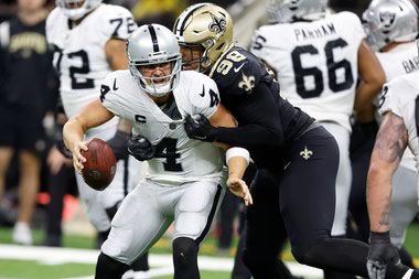 Saints defensive end Payton Turner sacks Las Vegas Raiders quarterback Derek Carr October 30 in New Orleans.