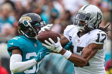 Raiders receiver Davante Adams (17) catches a touchdown pass against Jaguars cornerback Tyson Campbell on November 6.