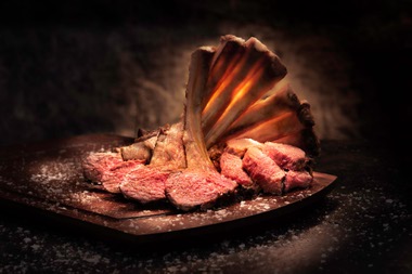 For the ultimate spectacle, order the Woww Wagyu steak, a 10-ounce thick-cut striploin oozing with juicy flavor and served on a family-style wooden cutting board.
