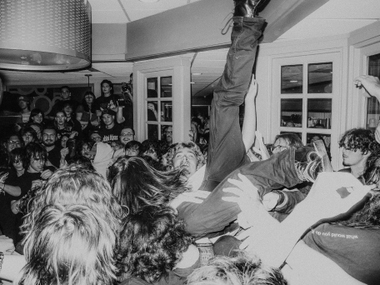 Before long, bodies were squeezing into the dining area to watch the musicians, get into the fairly intense moshpit and even crowd-surf through the International House of Pancakes.

