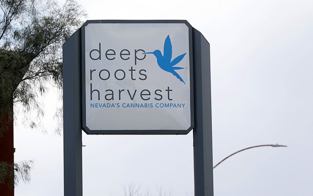 Signage at Deep Roots Harvest dispensary on West Cheyenne Road Tuesday, March 26, 2024.
