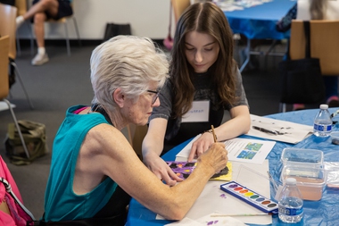 At left, Nancy Nelson works on an art project with volunteer assistant Riannon Stocklen at the Cleveland Clinic Lou Ruvo Center for Brain Health on August 5.