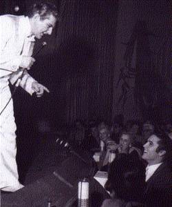 Liberace, recognizing a face in the crowd at the Riviera's Clover Room.