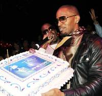 Jamie Foxx receives his second birthday cake of the night at Tao. On the mic is good friend P.Diddy.