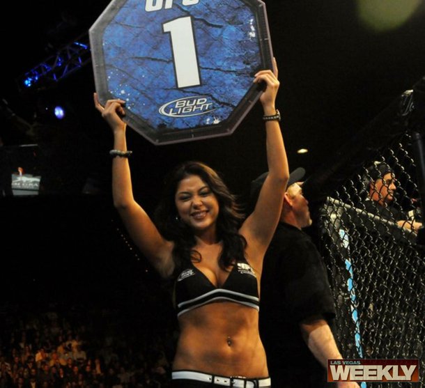 Ring girl Arianny Celeste signals the start of a fight.
