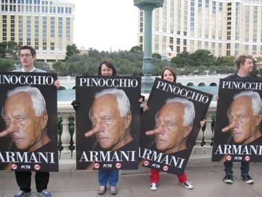 PETA protesters line the Strip on Monday, January 26 for a boycott of Armani’s new fur-heavy collection. 