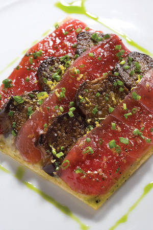 Carpaccio made with ahi tuna on a clever tart constructed from eggplant.