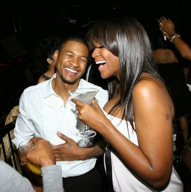 Usher and his wife, Tameka Foster, share a laugh.