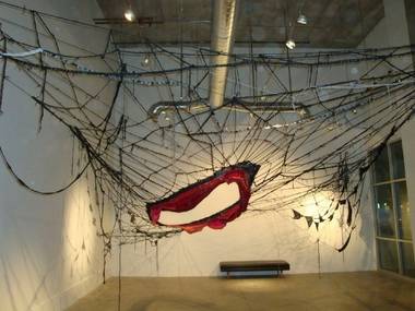  Sheila Pepe’s large installation piece, constructed from yarn, shoelaces and hardware. 
