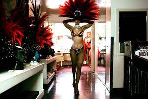 Showgirl Svetlana Failla secures her headdress before going onstage for the opening number of “Folies Bergere” at Tropicana Showroom.