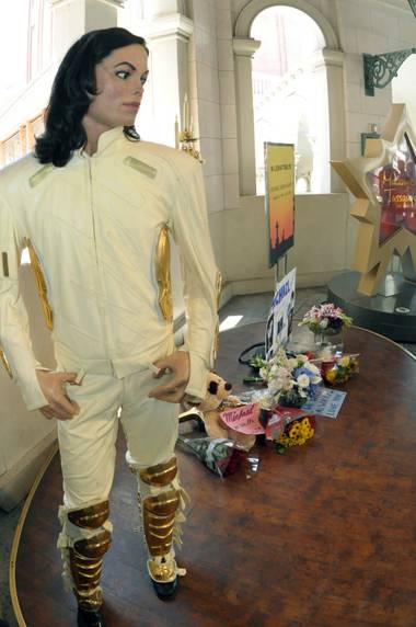 A wax figure and tribute to Michael Jackson stand in front of Madame Tussauds Las Vegas at The Venetian.