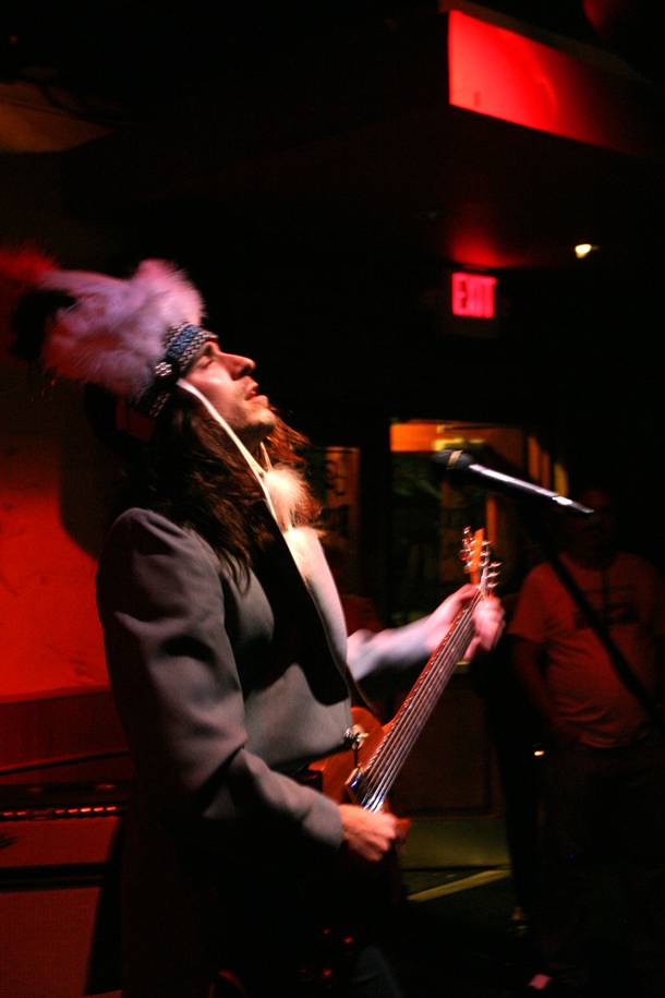 Singer and guitarist Daniel James, of Leopold and His Fiction, sporting a Native American headdress, bested himself by topping his own pheasant feather hat at the last installment of Neon Reverb. 