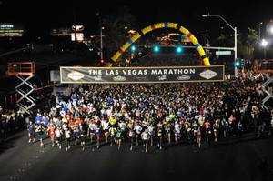 Crowds swarm the starting line of the Las Vegas Marathon.