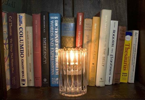 Lots of candles and books add to the living room feel of the Artisan Hotel lounge. The lounge has become a popular late-night hangout for entertainers and musicians who come to the bar after their shows.