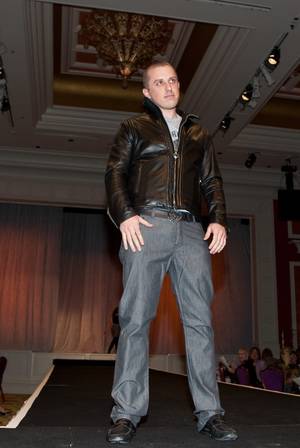 Tao Group entertainment marketeer Mike Snedegar struts down the catwalk in a King Baby leather jacket and shirt and slacks by John Varvatos.