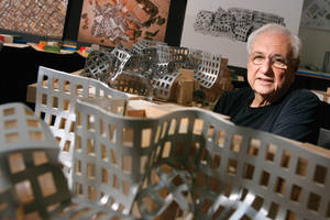 Architect Frank Gehry with models of his Ruvo Center design.