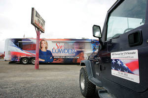 Sue Lowden's lazy left eye required some retouching for the side of her tour bus. 