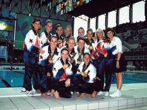 Suzannah (front left) and the rest of the 1996 U.S. Olympic synchronized swimming team poses with their gold medals.